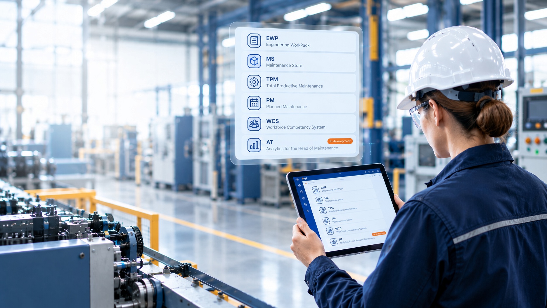 An engineer on a plant floor, checking modules on a tablet